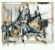 an abstract painting with blue, white and black paint on it's sides in a wooden frame