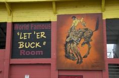 the side of a building with two paintings on it's wall and another sign that says world famous, let't be buck room