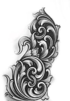 an intricate tattoo design on the back of a woman's arm, with swirls and