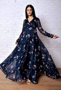 "**RooRichWear Presenting Designer Dark Blue Printed Gown** GOWN ----------------------- Fabric. :- Fox Georgette Work :- Flower Printed Work Sleeve :- 20\" Inch Flare :- 3.5 \"Umbrella flare Size :- M(38) L(40) XL(42) XXL(44) Height :- 52+ Inch Wear :- Dark Blue Knot For an absolutely stunning look, wear this Georgette maxi dress with long sleeve, Its specially designed for comfortableness and Crafted from Georgette. Note : Color may vary due to the photography in the light effect." Flower Print Gown, Indian Maxi Dress, Maxi Dress Indian, Floral Dresses With Sleeves, Umbrella Dress, Latest Maxi Dresses, Stylish Maxi Dress, Traditional Blouse Designs