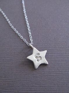 Recycled Silver Star Initial Charm Necklace Sterling Silver Symbolic Necklace With Star Charm, Symbolic Sterling Silver Star Charm Necklace, Sterling Silver Star Charm Necklace, Personalized Star-shaped Sterling Silver Jewelry, Silver Star Charm Necklaces For Anniversary, Silver Star Charm Necklace For Anniversary, Silver Star Shaped Charm Necklace, Silver Star-shaped Charm Necklace, Handmade Star Shaped Sterling Silver Necklace