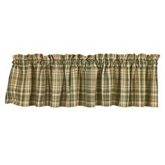 a window valil with a plaid pattern on the bottom and an attached ruffled edge