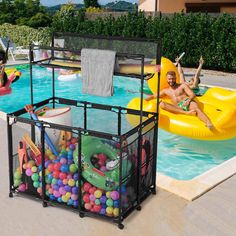 two people are playing in the pool with balls and water toys, while one person is on an inflatable raft