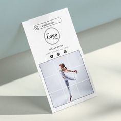 a white card with an image of a woman in yoga clothes on it's side