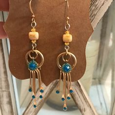 Hand-Crafted Bohemian Gold Earrings With Turquoise Swarovski Crystals Blue Bohemian Dangle Earrings, Blue Metal Earrings With Dangling Beads, Bohemian Blue Nickel-free Earrings, Bohemian Czech Glass Crystal Earrings Nickel Free, Bohemian Blue Earrings With Dangling Beads, Blue Bohemian Earrings With Dangling Beads, Bohemian Blue Dangle Hoop Earrings, Blue Bohemian Dangle Hoop Earrings, Turquoise Czech Glass Dangling Beads Earrings