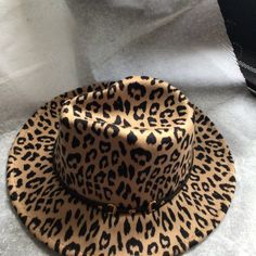 Animal Print Fedora Hat Chic Brown Winter Hats, Brown Brimmed Felt Hat For Vacation, Chic Brown Felt Hat For Beach, Chic Brown Felt Hat For The Beach, Chic Brown Felt Hat For Winter, Winter Vacation Brimmed Fedora, Brown Flat Brim Felt Hat For Vacation, Brown Felt Hat With Curved Brim For Vacation, Brown Curved Brim Felt Hat For Vacation