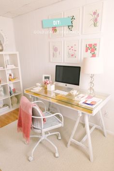 a white desk with a computer on top of it