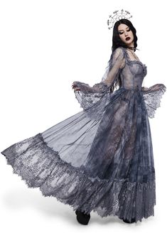 walk the line between life and the hereafter. This gothic maxi dress has a sheer mesh construction with lace trim, a script print all over, a bustier bodice with structured boning, long flared sleeves, a satin bow applique on the front, and a low square back with a zip closure. Witchy Dresses, Goth Gown, Grunge Wedding, Gothic Lace, Bow Applique, Maxi Gown, Fantasy Gowns, Lace Bustier, Vintage Gowns