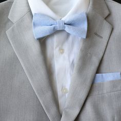 Color:  Sky Blue Imported and Handmade Material:  100% Cotton Adult Necktie Dimensions:  Skinny Width:  2.25 inches   Regular Length:  approx. 58 inches Adult Pre-Tied Bow Tie: approx. 4.75 inch width by 2.5 inch height Necksize 11.5 inches - 20 inches     Metal clasp for secure and comfortable wear. Child Pre-Tied Bow Tie:  approx. 4 inch width and 2 inch height   Necksize 11 inches - 19 inches    Plastic clasp for easy wear and removal. Pocket Square: 9 inches x 9 inches RETURN/EXCHANGE POLICY:  Please notify/message seller regarding an exchange and/or return within 30 days after delivery of package to open a case and we will walk you through the next steps.     CUSTOMER SERVICE:  We strive to provide the best customer service and products to our customers.  Please don't hesitate to cont Spring Suits For Grooms, Blue Spring Wedding Suit, Dapper Blue Business Ties, Dapper Blue Standard Tie, Classic Blue Bow Tie, Blue Tailored Ties For Business, Tailored Blue Formal Tie, Classic Blue Bow Tie And Suit Accessories, Blue Tuxedo For Groom