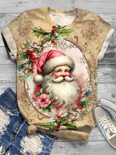 an image of santa claus on a t - shirt next to ripped jeans and sneakers