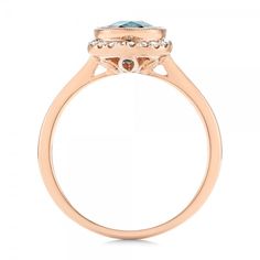 Rose Gold Diamond and London Blue Topaz Fashion Ring - Finger Through View Topaz Ring With Round Stone, Luxury Blue Topaz Halo Ring, Diamond And Topaz Gemstone Ring With Round Band, Luxury Halo Topaz Ring, Diamond Topaz Ring With Round Band, Aquamarine Diamond Ring With Round Cut, Aquamarine Diamond Ring With Halo Setting For Formal Events, Aquamarine Gemstone Diamond Ring In Round Cut, Luxury Topaz Rings With Halo Setting