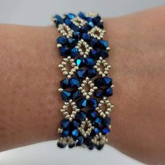 This Is A Silver And Blue 6 1/3 In Bracelet. This Bracelet Is Made With Austrian Crystals Fresh Off The Beading Table Hello, I Am Rita, A Master Bead-Weaver. I Have Kept My Work In The Family Until Now. Each Piece Is Carefully And Beautifully Hand Beaded Elegant Blue Beaded Crystal Bracelet, Blue Spacer Beads Bangle Jewelry, Blue Bangle With Spacer Beads, Blue Crystal Bracelet With Silver Beads, Elegant Blue Handmade Bracelets, Elegant Blue Crystal Bracelet With Silver Beads, Blue Jubilee Crystal Bracelet With Round Beads, Blue Faceted Beads Bangle Jewelry, Blue Faceted Bead Bangle