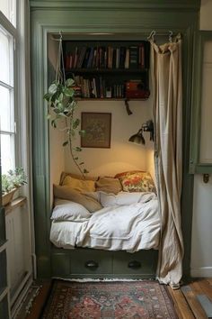 a bedroom with a bed, bookshelf and window in the corner that is open