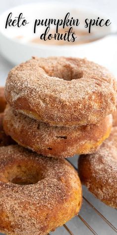 three donuts stacked on top of each other with the words keto pumpkin spice doughnuts