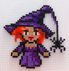 an image of a beaded witch on a white background