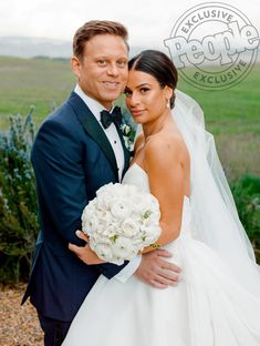 a bride and groom posing for the camera