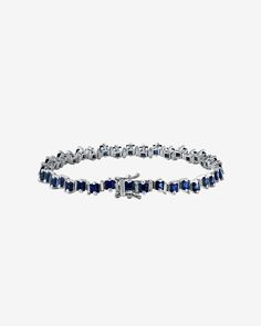 Crafted in 18-karat gold, this exquisite bracelet features radiant princess-cut dark blue sapphires, beautifully interlaced with alternating baguette diamonds. It's designed for comfort and daily wear, adding a touch of luxury to your everyday style. Details 18k white gold 7.80 carats of princess-cut dark blue sapphires 0.75 carats of baguette white diamonds Bracelet measures 7" inches in length Box clasp with safety lock fastening 5mm width Ref: AKB472 Elegant Sapphire Jewelry With Baguette Cut, Elegant Sapphire Baguette Cut Jewelry, Modern Sapphire Jewelry With Baguette Cut, Modern Baguette Cut Sapphire Jewelry, Elegant Baguette Cut Sapphire Jewelry, Luxury Sapphire Jewelry With Baguette Diamonds, Timeless Blue Jewelry With Baguette Diamonds, Baguette Cut Sapphire Jewelry, Classic Sapphire Jewelry With Baguette Diamonds