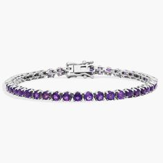 Brilliant purple amethysts shimmer as this timeless tennis bracelet catches the light. The 3mm-wide sterling silver design promises enduring quality and the cool gleam complements the stones. Anniversary Amethyst Gemstone Tennis Bracelet, Elegant Purple Tennis Bracelet, Elegant Purple Amethyst Tennis Bracelet, Classic Silver Gemstone Tennis Bracelet, Elegant Silver Tennis Bracelet With Amethyst, Elegant Silver Amethyst Tennis Bracelet, Formal Amethyst Gemstone Tennis Bracelet, Elegant Silver Tennis Bracelet, Purple Tennis Bracelet For Anniversary