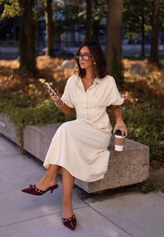 This teacher-inspired dress boasts vertical stripes for a slimming effect, making it an ideal wardrobe choice. The button-down design exudes a classic elegance while the maxi length offers a sophisticated flair. Show off your sense of style with this stylish and flattering dress. Fabric 50% cotton, 50% polyester Chic Vertical Stripe Shirt Dress, Classic Striped Shirt Dress, Casual Striped Maxi Dress For Work, Classic Striped Shirt Dress For Work, Elegant Striped Shirt Dress For Daywear, Short Sleeve Dresses With Vertical Stripes For Work, Classic Summer Maxi Dress, Striped Maxi Dress For Workwear In Spring, Spring Striped Maxi Dress For Work