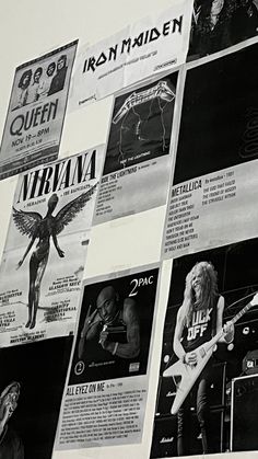 a wall covered with posters and pictures of rock bands in black and white, including an electric guitar