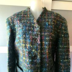 This is BELLESSA mohair wool jacket made of dark green variegated yarn with blue, purple and pink threads that makes the jacket stand out. The buttons on the jacket are metal with an engraving that says 'Entrangere Legion' (translated from french as 'Foreign legion'. There are buttons in front and on its sleeves. The jacket has two pockets and is in excellent/mint condition. The lining is navy blue silk satin. The jacket is medium, good for 8-10 US size. The jacket is in excellent/mint condition Green Wool Winter Cardigan, Green Fitted Wool Cardigan, Casual Green Wool Blazer, Green Long Sleeve Tweed Jacket For Winter, Fitted Multicolor Wool Outerwear, Multicolor Mohair Cardigan For Fall, Green Wool Outerwear With Buttons, Green Wool Long Sleeve Blazer, Green Wool Tweed Jacket With Long Sleeves