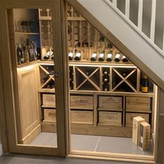 an under stair case with wine bottles in it