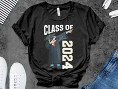 Class of 2024 graduation gifts idea for boys men     Unisex Gildan T-shirt * 100% ring-spun cotton * Sport grey is 90% ring-spun cotton, 10% polyester * Dark heather is 65% polyester, 35% cotton * 4.5 oz/y² (153 g/m²) * Pre-shrunk * Shoulder-to-shoulder taping * Quarter-turned to avoid crease down the center     Unisex Bella Canva Shirt * 100% combed and ring-spun cotton (heather colors contain polyester) * Fabric weight: 4.2 oz (142 g/m2) * Pre-shrunk fabric * Shoulder-to-shoulder taping * Side-seamed     Unisex Bella Canva Tank top * 100% combed and ringspun cotton * Tri-blends are 50% polyester/25% combed/25% ringspun cotton/rayon * Side-seamed, unisex sizing * Sizes - XS-2XL     Women Shirt Next Level 3900 100% combed ringspun cotton (fiber content may vary for different colors) Light Pre-shrunk Cotton T-shirt For Graduation Party, Black Pre-shrunk T-shirt For Graduation Gift, Cotton Graduation T-shirt, Cotton T-shirt For Graduation, School Spirit Cotton T-shirt For Graduation, School Spirit Cotton T-shirt For Graduation Gift, Black Short Sleeve T-shirt For Graduation Gift, Cotton T-shirt For Graduation Party, Graduation Gifts For Boys