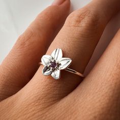 Title: Violet February Birth Month Flower Ring with  Amethyst Birthstone Material: Material:  Solid 14k Yellow Gold, 14k White Gold, 14k Rose Gold or solid 925 Sterling Silver.  18k and 9k Gold are available upon request. Timeline: Custom made to order (2 weeks) Size:  Stone: 2 mm genuine AA grade brilliant cut and 1.2-3 solid round band Special Options: I offer different gemstones upon request.  Story: Violet Flower: Amethyst Ring The violet has been thought to symbolize modesty, faithfulness, Flower Shaped Amethyst Jewelry For Anniversary, Sterling Silver Flower Ring With Birthstone For Gift, Sterling Silver Flower Ring With Birthstone For Wedding, Delicate Amethyst Gemstone Ring For Anniversary, Sterling Silver Birthstone Flower Ring For Wedding, Gemstone Flower Ring For Anniversary, Fine Jewelry Flower-shaped Birthstone Promise Ring, Sterling Silver Flower Ring With Accent Stones For Gift, Flower Shaped Gemstone Ring For Anniversary