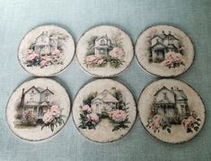 six plates with houses and flowers on them