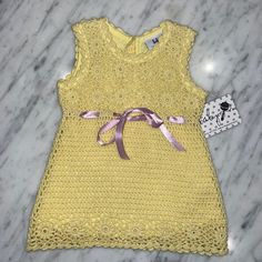 New Sweater Knit Dress. Its A Beautiful Yellow With A Purple Satin Ribbon Running Around The Waist. The Ribbon Can Easily Be Pulled Out Completely Or Replaced With Any Other Color. All Of My Items Are New With The Tags. Fitted Crochet Cotton Dress In Cute Style, Cute Fitted Crochet Cotton Dress, Fitted Sleeveless Crochet Dress In Cute Style, Cute Cotton Crochet Dress For Spring, Cute Fitted Sleeveless Crochet Dress, Cute Fitted Crochet Dress, Yellow Dress Crochet, Spring Yellow Crochet Dress, Yellow Sweater Dress