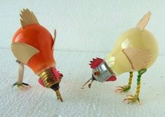 two plastic chickens with different colored heads and legs, one pecking at the other