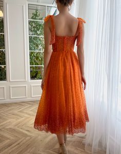 Step into the spotlight in this midi-length sequined gown, cut and crafted to perfection. The sweetheart neckline is highlighted by the corseted waist, created with built-in pads and adorned with sparkling bow straps. In any shape or size, with this stunningly orange Igniting Embers Gown you will look glamourous as ever!