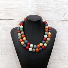 Chunky Colorful Necklace, Colorful Double Strand Necklace, Chunky Multicolor Necklace, Colorful Ceramic Necklace, Multicolor Beaded Necklace This FABULOUSLY COLORFUL double strand necklace was hand beaded using large 15mm round multicolor neutral earth tone ceramic beads in shades of deep red, sea green, denim blue, orange, gray, and sand. It measures approximately 18 inches in length and is secured with a sterling silver toggle clasp. This necklace really adds a bold pop to any outfit! Check ou Multicolor Wooden Beads Necklaces For Jewelry Making, Multicolor Wooden Beads For Jewelry Making, Colorful Faceted Round Bead Necklaces, Colorful Necklaces With Faceted Round Beads, Multicolor Beaded Long Necklace With Wooden Beads, Multicolor Long Beaded Necklaces With Wooden Beads, Bohemian Multicolor Beaded Necklace, Multicolor Wooden Beads Necklaces For Gifts, Multicolor Wooden Bead Necklaces For Gifts