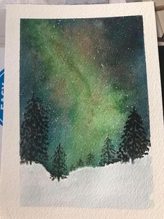 a watercolor painting of some trees in the snow with an aurora bore behind them