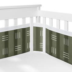 an open crib with green and white panels