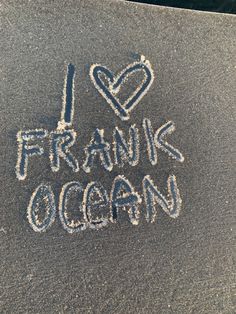 i love frang ocean written in chalk on the ground with white writing and hearts