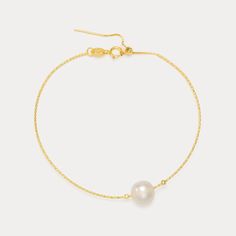 The Simple Pearl Bracelet is a classic piece for any woman’s bracelet collection, offering a touch of luster that complements both casual and formal attire with its timeless appeal. Wear our Simple Pearl Bracelet, A single, and lustrous freshwater pearl adorns a delicate chain made from 18K gold-plated sterling silver. This minimalist yet luxurious piece perfect for complementing any ensemble. Whether paired with professional attire or evening looks, the luminous pearl adds a touch of radiant be Elegant Adjustable Pearl Chain Bracelet, Timeless Formal Bracelet With Pearl Chain, Classic Charm Bracelet As Gift, Timeless Formal Pearl Chain Bracelet, Classic Bangle Charm Bracelet For Formal Occasions, Elegant Gold Bracelet With Adjustable Chain For Wedding, Gold Classic Charm Bracelet, Gold Minimalist Bracelet For Formal Occasions, Classic Charm Bracelet With Adjustable Chain