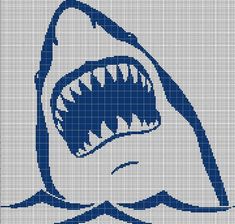 a cross stitch shark with its mouth open