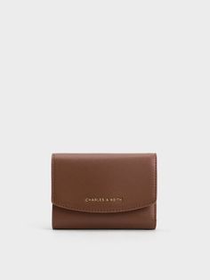 This product is made with at least 20% sustainable materials by weight. CHARLES & KEITH uses recycled, degradable, organic, and water-based materials in our eco-conscious collection. This compact and classy chocolate-brown wallet is a great alternative to a black wallet. The caviar finish makes this piece incredibly durable, even with daily use. In addition to its compartmentalised interior that will easily hold your cash, cards and coins, it also comes with a rear patch pocket that can house loose change and other small items. Brown Wallet, Wallet Gifts, Black Wallet, Charles Keith, Its My Birthday, Kids Gifts, Sales Gifts, Card Wallet, Wallets For Women