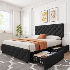 a bed with two drawers underneath it in a white and black bedroom area next to a large window