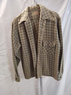 Vintage Mens light jacket, yellow/green/brown plaid. Classic straight cut wool jacket. No lining, one breast pock. Straight cut across bottom, button cuff. Small amount of wear, around buttons and on collar, Great piece and easily wearable. This is a vintage piece so being sold asis. Measures; chest 40, back shoulder 18, sleeve 25 Vintage Single Breasted Tweed Jacket With Long Sleeves, Vintage Single Breasted Tweed Jacket, Vintage Long Sleeve Tweed Jacket, Retro Brown Long Sleeve Tweed Jacket, Vintage Plaid Tweed Jacket With Long Sleeves, Vintage Brown Long Sleeve Tweed Jacket, Vintage Long Sleeve Tweed Jacket With Button Closure, Fitted Vintage Plaid Outerwear, Retro Vintage Brown Outerwear With Button Closure