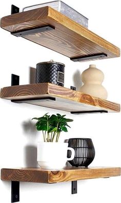 two wooden shelves with pots and vases on them