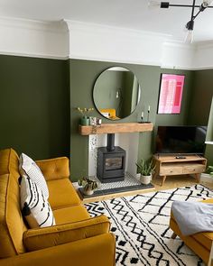 a living room filled with furniture and a fire place