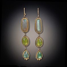 Celebrate a special occasion or revel in the beauty every day with these rose cut labradorite, vesuvianite and blue green tourmaline earrings. Rich 22k bezel surrounds each stone with the bottom green tourmaline drops accented with three 22k dots. Sterling silver backing; 18k earwires. Matte finish. Earrings hang approximately 2 inches. Each stone is unique and may vary from image. Rough Rose Quartz, Green Tourmaline Ring, Dangle Earrings Boho, Amethyst Studs, Triangle Earrings Stud, Turquoise Drop Earrings, Tourmaline Earrings, Triangle Studs, Geometric Studs