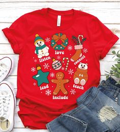 a red t - shirt with christmas characters on it