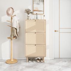 a white room with a coat rack and shoes