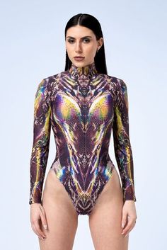 Wrap yourself in hues of intrigue and confidence. This costume fits like a second skin, enveloping your curves in delicate iridescence and reflecting every facet of your unapologetic personality. FEATURES: > Cheeky cut > Long sleeves  > Mock neckline  > Front Zip Closure  > 80% Spandex / 20% Elastane > Non-Transparent Lycra  > 30° Cold Wash, Hang dry Mock Neckline, Second Skin, Long Sleeves, Confidence, Spandex, Skin, Long Sleeve