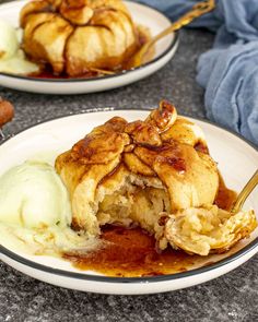 two white plates topped with pancakes covered in syrup and ice cream next to each other