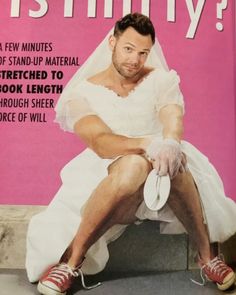 a magazine cover with a man in a wedding dress