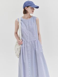 This is a trendy and feminine dress by NILBY P that is made out of high quality and sturdy material. With distinctive mood of the design and comfortable wear, you can style it for your casual daily outfit.- Shirring detail on the waist- Button down closure on the front- Feminine and trendy mood Casual Cotton Midi Dress For Daywear, Pleated Cotton Midi Dress, Cotton Pleated Midi Dress, Casual Spring Midi Dress With Gathered Waist, Summer Cotton Midi Dress With Gathered Waist, Casual Cotton Dresses With Gathered Waist, Relaxed Fit Dress With Gathered Waist For Summer, Relaxed Fit Summer Dress With Gathered Waist, Relaxed Fit Midi Dress With Gathered Waist